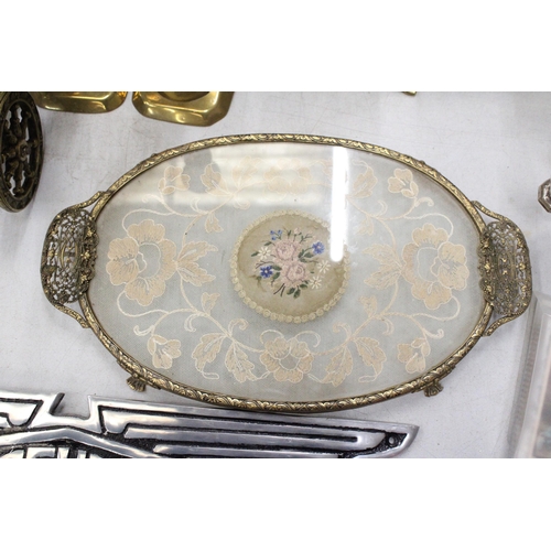 221 - A PETIT POINT EMBROIDERED DRESSING TABLE TRAY WITH A PAIR OF BRASS CANDLESTICKS