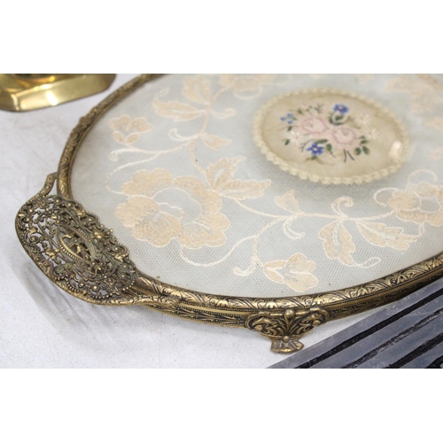 221 - A PETIT POINT EMBROIDERED DRESSING TABLE TRAY WITH A PAIR OF BRASS CANDLESTICKS