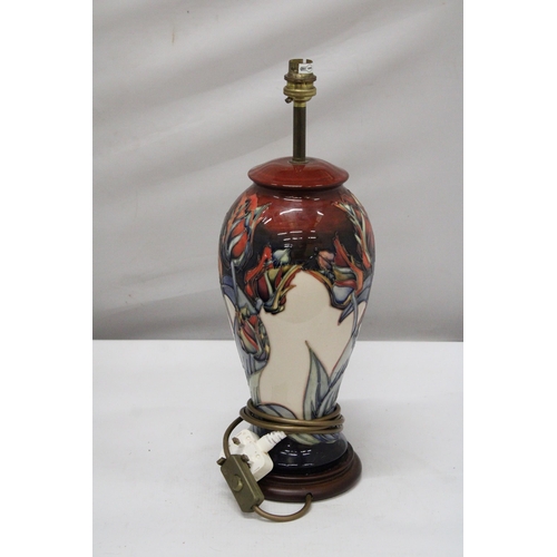 1 - A MOORCROFT POTTERY TABLE LAMP OF INVERTED BALUSTER FORM TUBELINED AND PAINTED WITH RED TULIPS PATTE... 