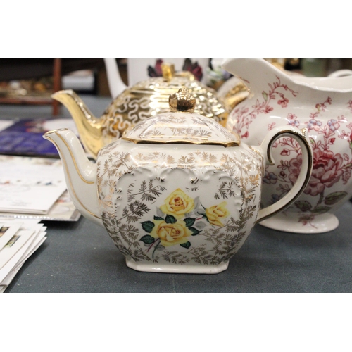 143 - A VINTAGE SADLER CHINTZ CUBE SHAPED TEAPOT TOGETHER WITH A ROYAL ALBERT 