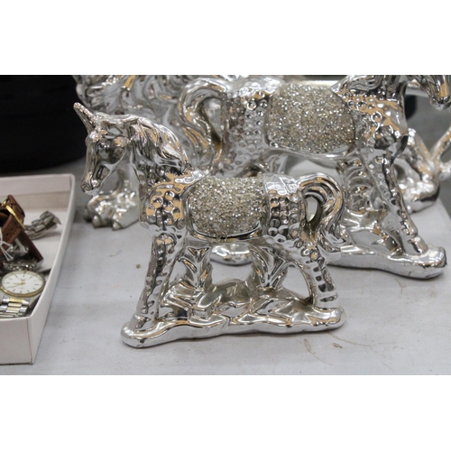 183 - FOUR ORNATE SILVER ANIMAL FIGURES TO INCLUDE A PARROT, LION AND TWO UNICORNS