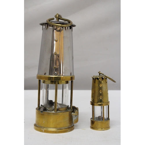 2 - A PROTECTOR LAMP AND LIGHTING 6 M & Q SAFETY LAMP - MAKERS ECCLES TOGETHER WITH A SMALLER PROTECTOR ... 