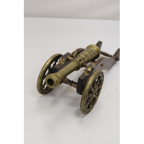 207 - A WOOD AND BRASS CANNON