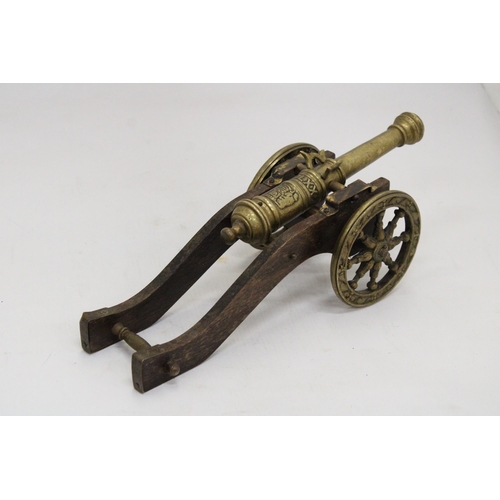 207 - A WOOD AND BRASS CANNON