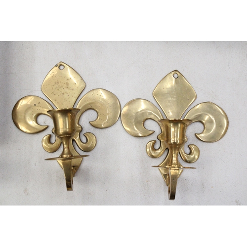 208 - A PAIR OF BRASS FLEUR DE LYS CANDLE HOLDER SCONCES