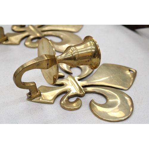 208 - A PAIR OF BRASS FLEUR DE LYS CANDLE HOLDER SCONCES