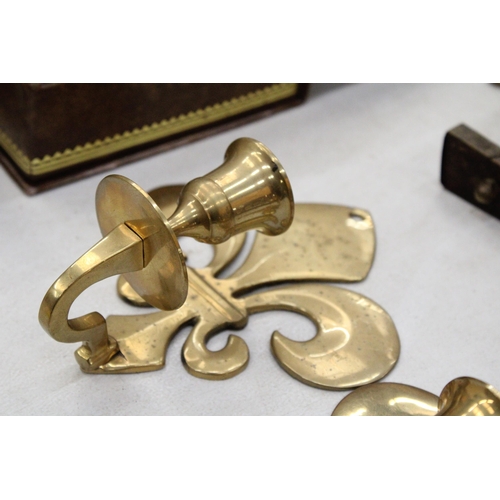 208 - A PAIR OF BRASS FLEUR DE LYS CANDLE HOLDER SCONCES