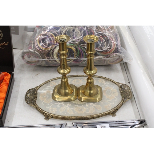 221 - A PETIT POINT EMBROIDERED DRESSING TABLE TRAY WITH A PAIR OF BRASS CANDLESTICKS