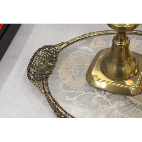 221 - A PETIT POINT EMBROIDERED DRESSING TABLE TRAY WITH A PAIR OF BRASS CANDLESTICKS