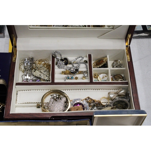 234 - A LARGE QUANTITY OF COSTUME JEWELLERY AND BOXES TO INCLUDE, BROOCHES, NECKLACES, BRACELETS, CUFF LIN... 