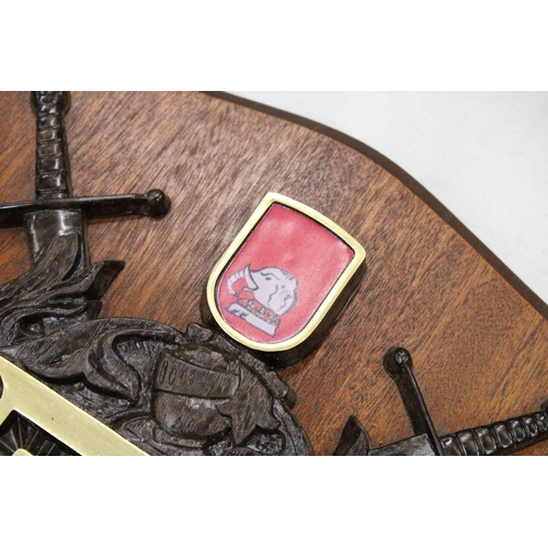 248 - A MAHOGANY SHIELD WITH A COAT OF ARMS FOR 'PARKER', 25CM X 32CM