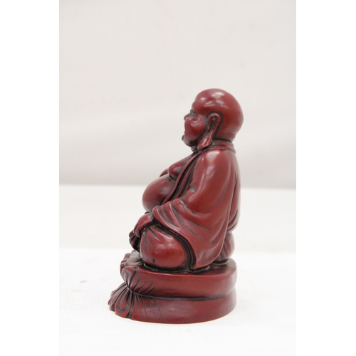 253 - A FIGURE OF A LAUGHING RED BUDDAH