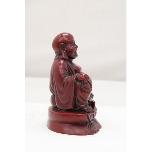 253 - A FIGURE OF A LAUGHING RED BUDDAH