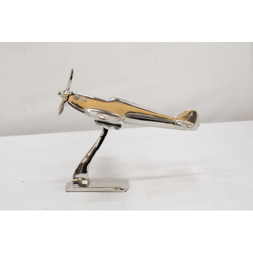 303 - A CHROME MODEL OF A SPITFIRE ON A BASE, HEIGHT 13CM, LENGTH 19CM