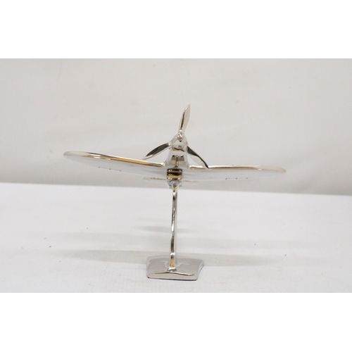 303 - A CHROME MODEL OF A SPITFIRE ON A BASE, HEIGHT 13CM, LENGTH 19CM