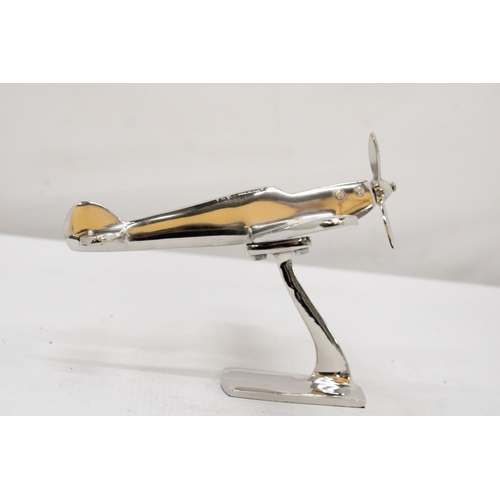 303 - A CHROME MODEL OF A SPITFIRE ON A BASE, HEIGHT 13CM, LENGTH 19CM