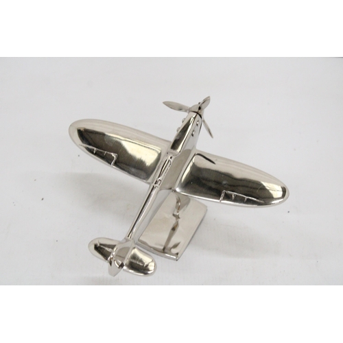 303 - A CHROME MODEL OF A SPITFIRE ON A BASE, HEIGHT 13CM, LENGTH 19CM