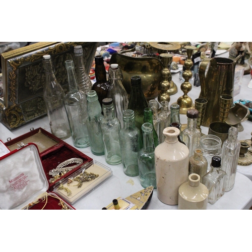 314 - A LARGE COLLECTION OF VINTAGE GLASS AND STONEWARE BOTTLES