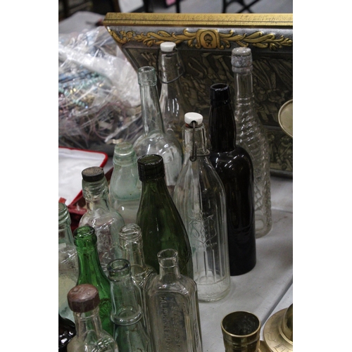 314 - A LARGE COLLECTION OF VINTAGE GLASS AND STONEWARE BOTTLES