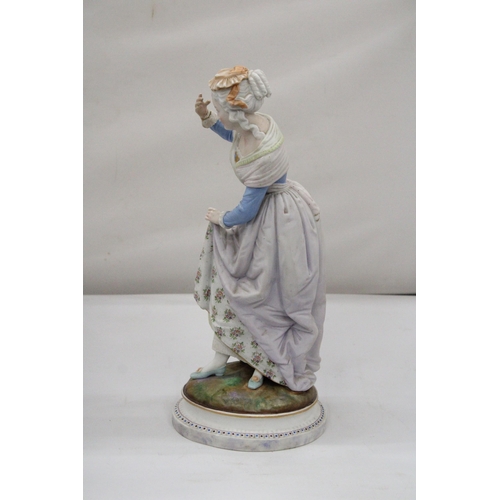 101 - A CONTINENTAL FIGURE OF A LADY IN PERIOD DRESS - APPROX 41 CM