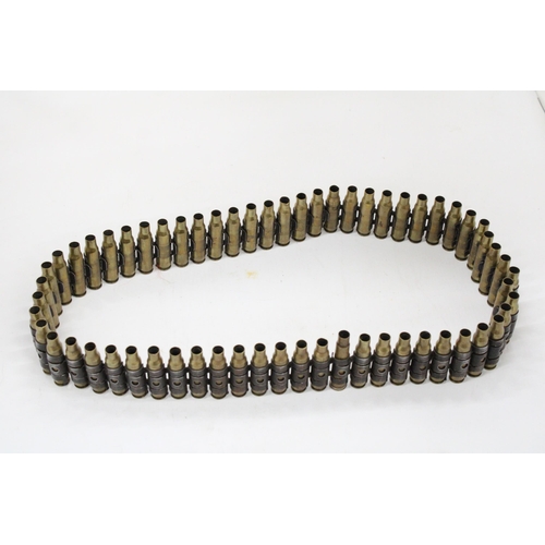 110 - A VINTAGE STEEL AND BRASS BULLET BELT WITH 62 SECTION