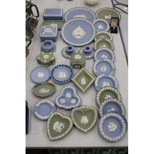 111 - A LARGE QUANTITY OF WEDGWOOD JASPERWARE TO INCLUDE CANDLESTICKS, TRINKET BOXES, PIN DISHES, CHRISTMA... 