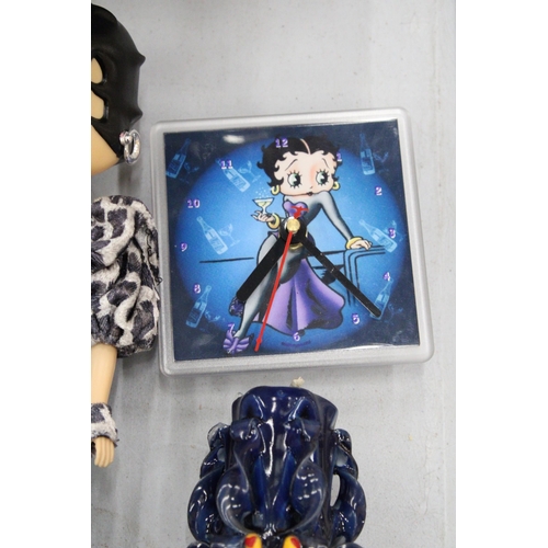 129 - A BETTY BOOP CLOCK, CANDLE AND 13 INCH FIGURE