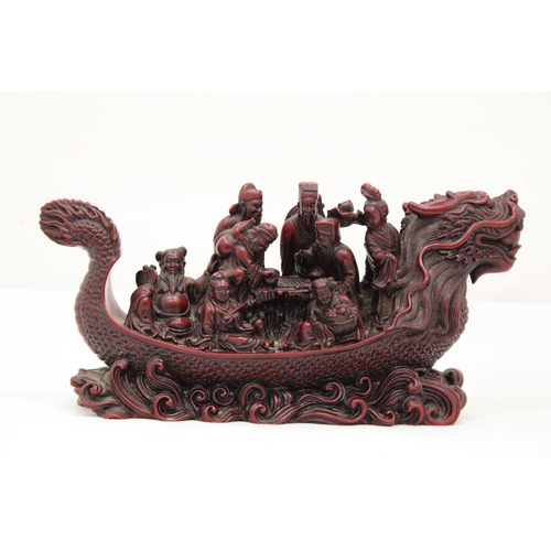 13 - A HEAVY RED RESIN DRAGON SHIP WITH EIGHT MANDARIN MARINERS, 11