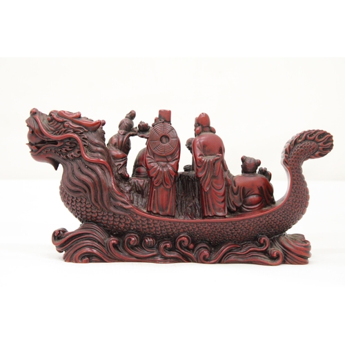 13 - A HEAVY RED RESIN DRAGON SHIP WITH EIGHT MANDARIN MARINERS, 11