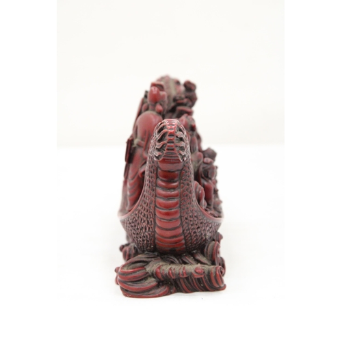 13 - A HEAVY RED RESIN DRAGON SHIP WITH EIGHT MANDARIN MARINERS, 11