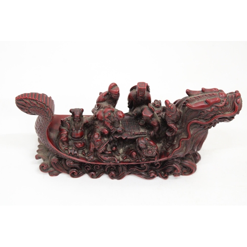 13 - A HEAVY RED RESIN DRAGON SHIP WITH EIGHT MANDARIN MARINERS, 11