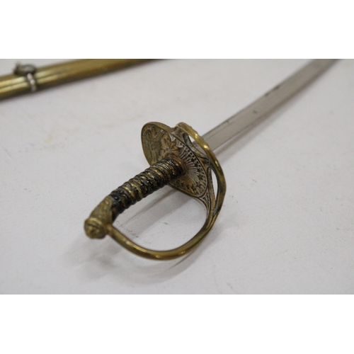 28 - A BRASS AND WHITE METAL ARTILLERY OFFICERS SWORD LETTER OPENER