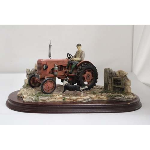 375 - A LARGE LEONARDO MODEL OF A TRACTOR AND COLLIE DOG AT HOME FARM ON A WOODEN PLINTH