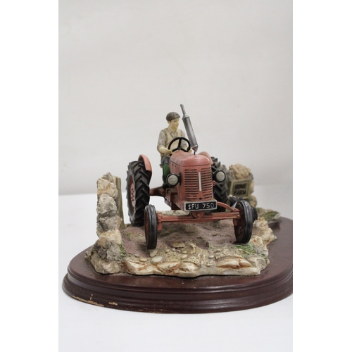 375 - A LARGE LEONARDO MODEL OF A TRACTOR AND COLLIE DOG AT HOME FARM ON A WOODEN PLINTH