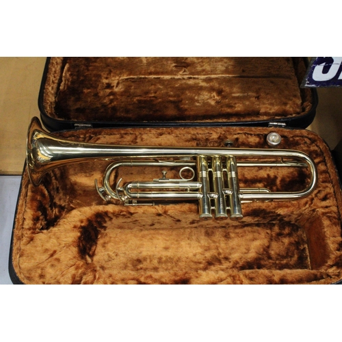 51 - A CASED BRASS TROMBONE BY CORTON