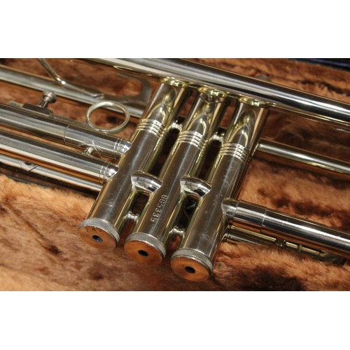 51 - A CASED BRASS TROMBONE BY CORTON