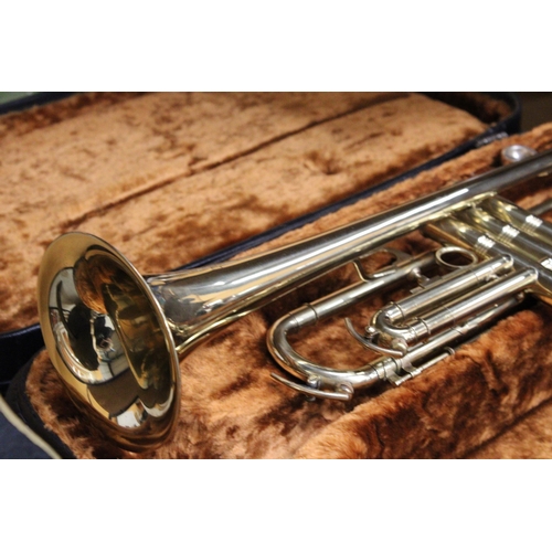 51 - A CASED BRASS TROMBONE BY CORTON