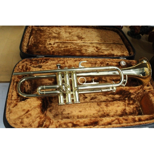 51 - A CASED BRASS TROMBONE BY CORTON