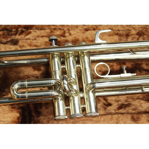 51 - A CASED BRASS TROMBONE BY CORTON