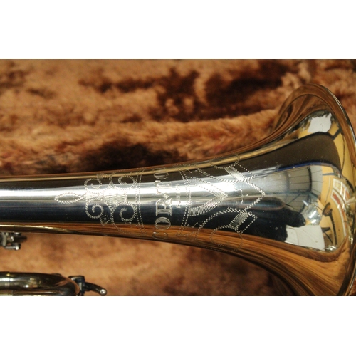 51 - A CASED BRASS TROMBONE BY CORTON