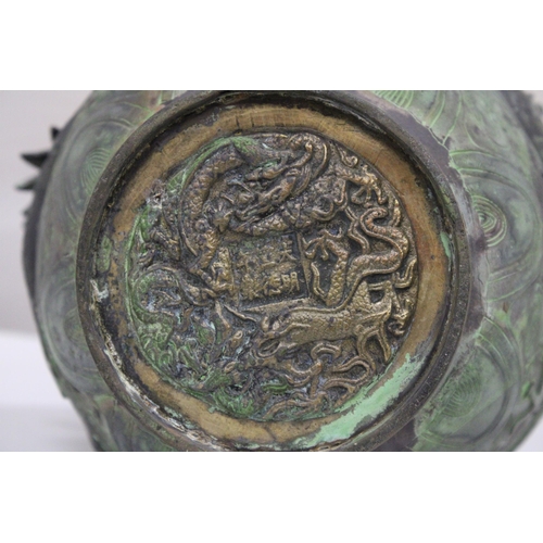 7 - A CHINESE BRASS RAISED BALUSTER VASE WITH FIGURAL MYTHICAL SCROLLING DRAGONS CHASING A FLAMING PEARL... 