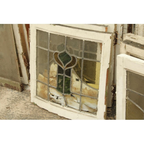 A LARGE ASSORTMENT OF WOODEN FRAMED STAIN GLASS WINDOWS