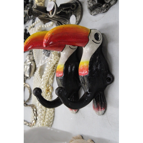 471 - A PAIR OF CAST GUINNESS TOUCAN COAT HOOKS