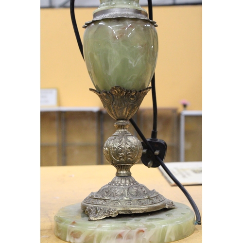 71 - AN ONYX TABLE LAMP WITH BRASS PUTTI DECORATION WITH SHADE