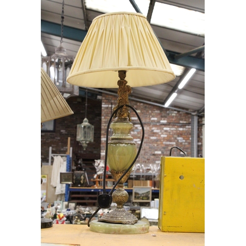 71 - AN ONYX TABLE LAMP WITH BRASS PUTTI DECORATION WITH SHADE