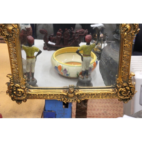 75 - AN ORNATE GILTWOOD MIRROR WITH CHERUB DETAIL