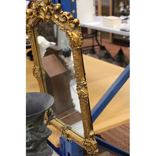 75 - AN ORNATE GILTWOOD MIRROR WITH CHERUB DETAIL