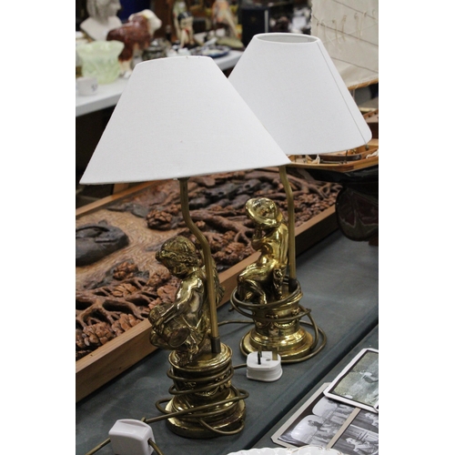 77 - A PAIR OF GILT FIGURAL COMPOSITE TABLE LAMPS