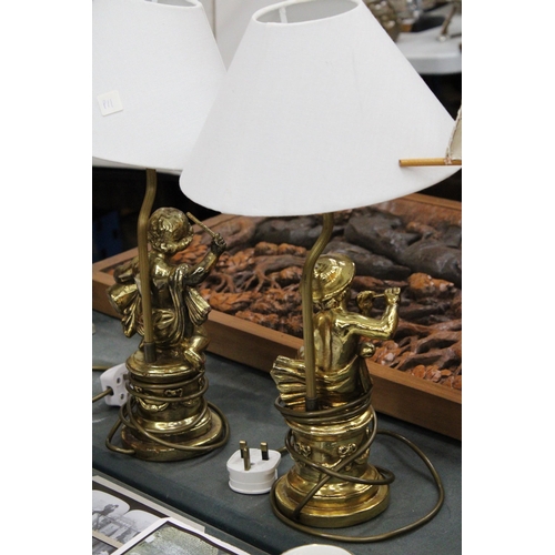 77 - A PAIR OF GILT FIGURAL COMPOSITE TABLE LAMPS