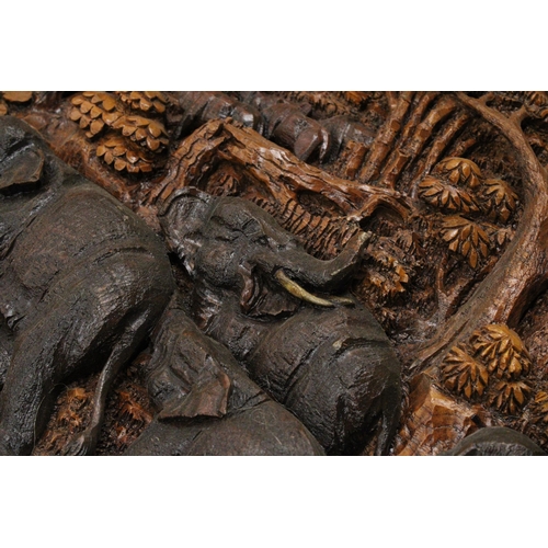 78 - A CARVED BALINESE WOODEN PANEL WITH THREE DIMENSIONAL WORK OF ART - APPROX 142 X 49 CM